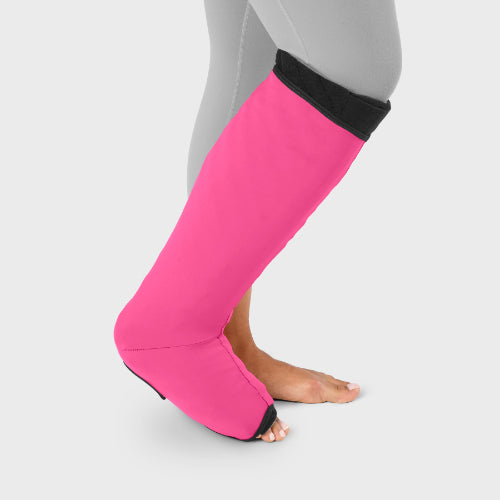 Person wearing their sleep sleeve over the Solaris Tribute below knee wrap in the color raspberry.