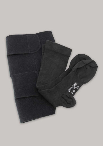 A photo of the Therafirm Ease Adjust Velcro Wrap along with a pair of Core-spun undersocks