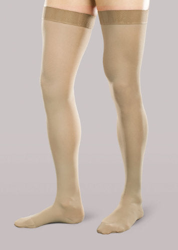 Male wearing his Therafirm  Ease Opaque Men's Thigh High 15-20 mmHg compression stockings in the color Khaki
