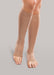 Lady wearing her Therafirm EASE Opaque Unisex Open Toe knee high 15-20 mmHg compression stockings in the color sand