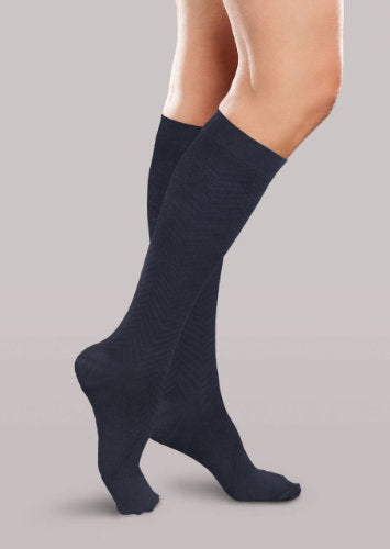 Lady wearing her Therafirm EASE Opaque Women's Chevron Trouser Socks 15-20 mmHg compression in the color black