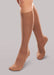 Lady wearing her Therafirm EASE Opaque Women's knee high 15-20 mmHg compression stockings in the color bronze