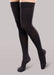 Lady wearing her Therafirm EASE Opaque Women's thigh high 15-20 mmHg compression stockings in the color black