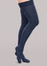 Lady wearing her Therafirm EASE Opaque Women's thigh high 15-20 mmHg compression stockings in the color navy
