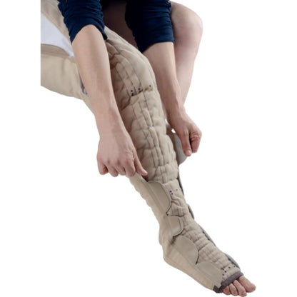 Person putting their Thuasne Mobiderm AutoFit Thigh High nighttime garment on