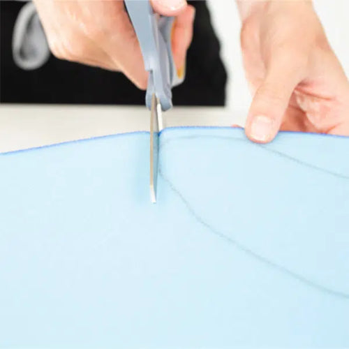 someone cutting the Circaid FLEC high-density, open-cell foam 