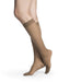 Female legs wearing Sigvaris 782 Sheer Knee High Compression Stockings in the color Cafe
