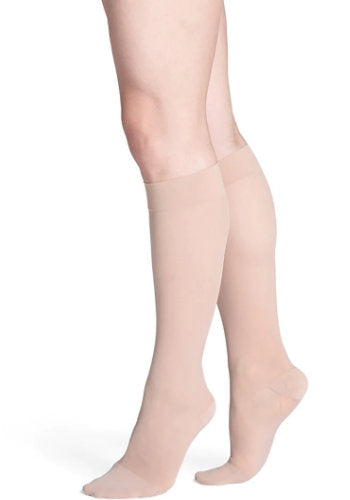 Female legs wearing Sigvaris 782 Sheer Knee High Compression Stockings in the color Toasted Almond