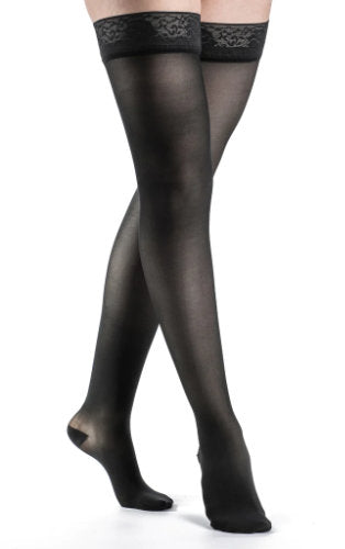 Woman wearing Sigvaris 782N 20-30 mmHg Thigh High Comrpession Stockings in the color Black