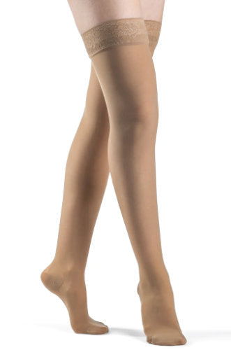 Lady wearing 783N Sheer Compression Thigh Highs in the Color Golden