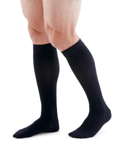 Male wearing his Medi Duomed Patriot Ribbed Compression Socks in the Color Navy