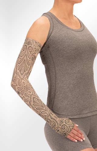 Juzo Soft Arm Sleeve  with Silicone Band in the Paisley Henna-Beige Print. Available in 15-20 mmHg, 20-30 mmHg, and 30-40 mmHg Compression