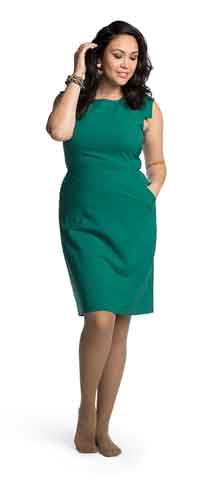 Lady in green dress wearing Sigvaris brand mocha colored Sheer compression stockings