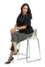 Lady sitting in a chair wearing her Sigvaris Sheer Stockings 