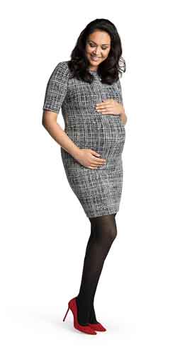 Happy looking pregnant lady wearing her Sigvaris Maternity Stockings | 841M 15-20 mmHg