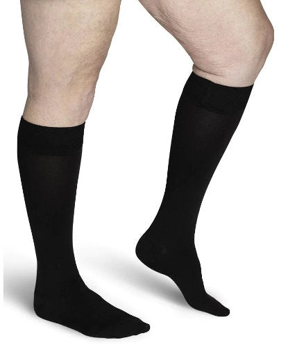 Womans leg showing the Sigvaris Secure Compression Stockings Color Black
