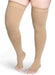 Lady wearing Sigvaris Secure Thigh High compression stockings with an open toe in the color Beige