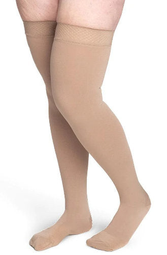 Lady wearing her beige thigh high Compression Stockings from Sigvaris | Secure 553N