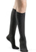 Ladies leg wearing the Sigvaris 843C Medical Compression Knee High Stockings in the color Graphite