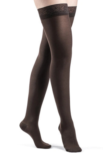 Lady wearing Sigvaris 842N Soft Opaque Thigh High Closed Toe Compression Stockings in the color Espresso