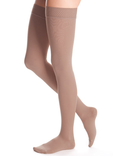 Woman wearing Medi Duomed Advantage Thigh High Compression Stockings in the color Beige