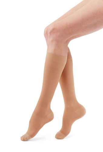 Woman wearing Medi Duomed Transparent Sheer Knee High Compression Stockings in the color Nude