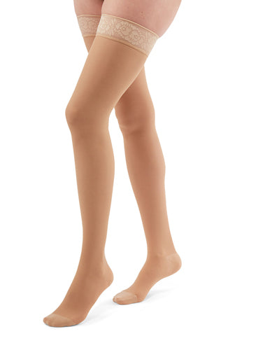 Woman wearing her Duomed Transparent Thigh High Compression Stockings in the color Nude