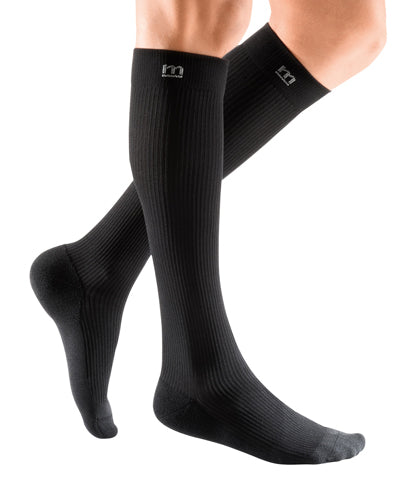 Female leg wearing the Mediven Active 20-30 mmHg Compression Socks in the Color Black