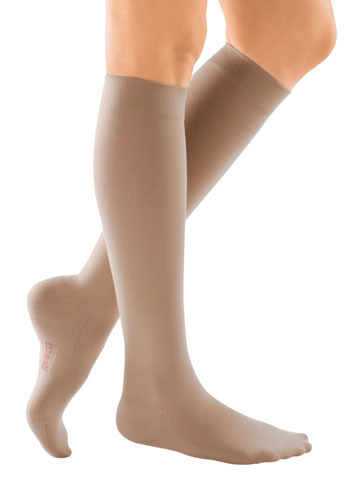 Lady wearing Mediven Comfort Compression Knee High Stockings in the color Natural