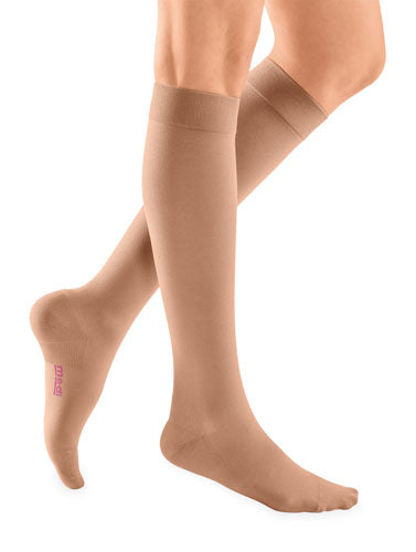 Female wearing her Mediven Plus Closed Toe Knee High 20-30 mmHg Compression Socks in the color Beige
