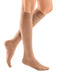 Woman wearing her Mediven Plus 30-40 mmHg Compression Stockings in the color Beige