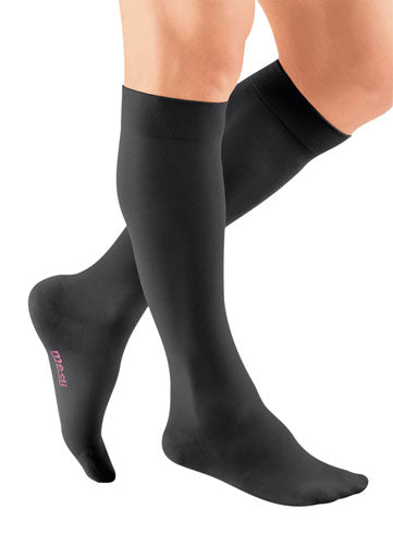 Male wearing his Mediven Plus Closed Toe Knee High 20-30 mmHg Compression Socks in the color Black
