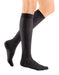 ladies legs wearing a pair of black colored Mediven Sheer & Soft knee high compression stockings