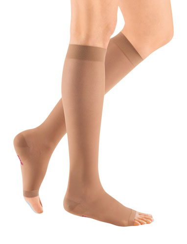 Woman wearing her Mediven Sheer and Soft Open Toe 30-40 mmHg Compression Stockings in the color Natural