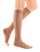 Woman wearing her Mediven Sheer and Soft Open Toe 30-40 mmHg Compression Stockings in the color Natural