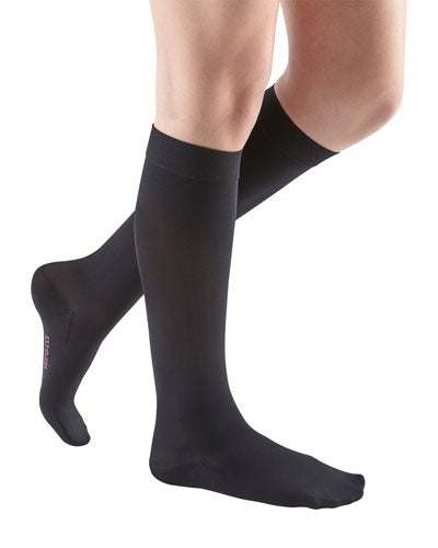 Female leg showcasing the Mediven Comfort Closed Toe Knee High in the color Ebony