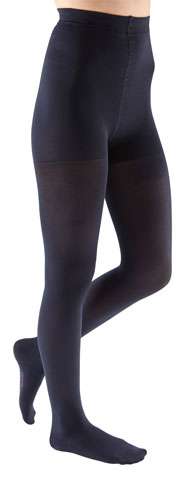 Lady wearing her Mediven Comfort Waist High Compression Stockings in the color Navy