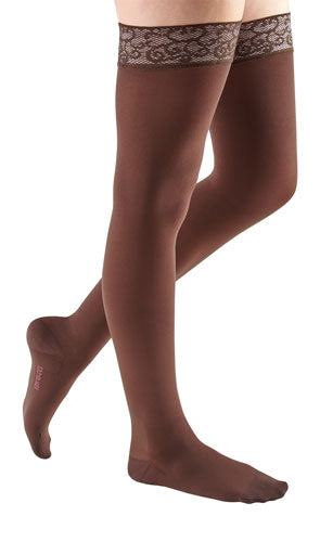 Female wearing her Mediven Comfort Compression Thigh Highs in the color Chocolate