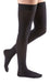 Woman's leg wearing the Medi Comfort Thigh High Compression Stocking with the Silicone Dot Band in the color Black