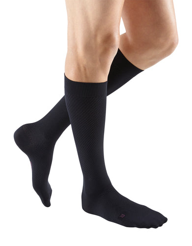 Guy wearing his Mediven for Men Select Compression Dress Sock 15-20 mmHg in the color Black