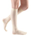 pair of Mediven knee high sheer and soft compression stockings in the color wheat and compression level 8-15 mmHg
