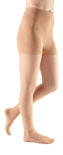Lady wearing her Mediven Sheer & Soft 15-20 mmHg Waist High Compression Stockings in the color Toffee