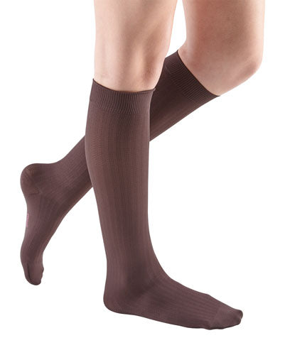 Lady wearing her Mediven Comfort Vitality Dress Sock 30-40 mmHg | Color Chocolate