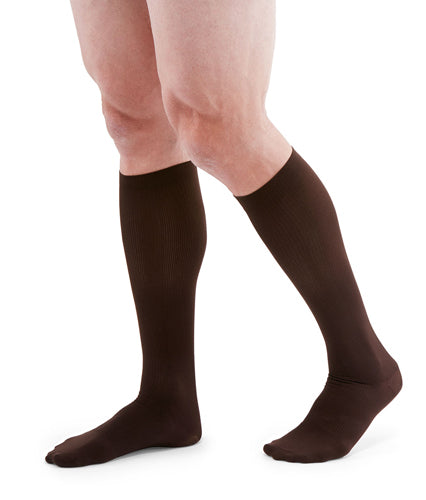 Man wearing his Mediven for Men Classic Ribbed Dress Socks | 20-30 mmHg Compression in the Color Brown