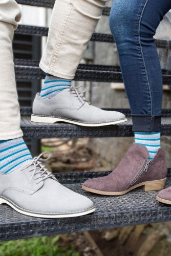 Couple wearing their Rejuva Gray and Teal Compression Socks 